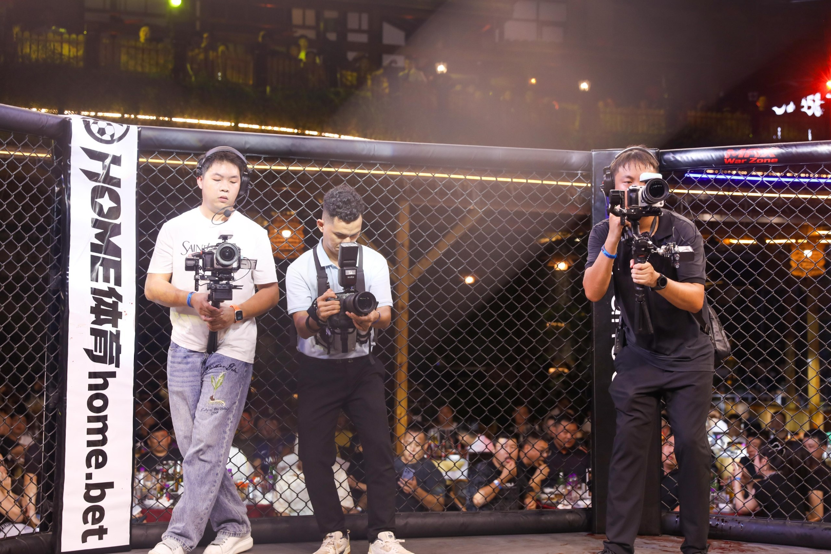 A camera and photography team working at a sporting event