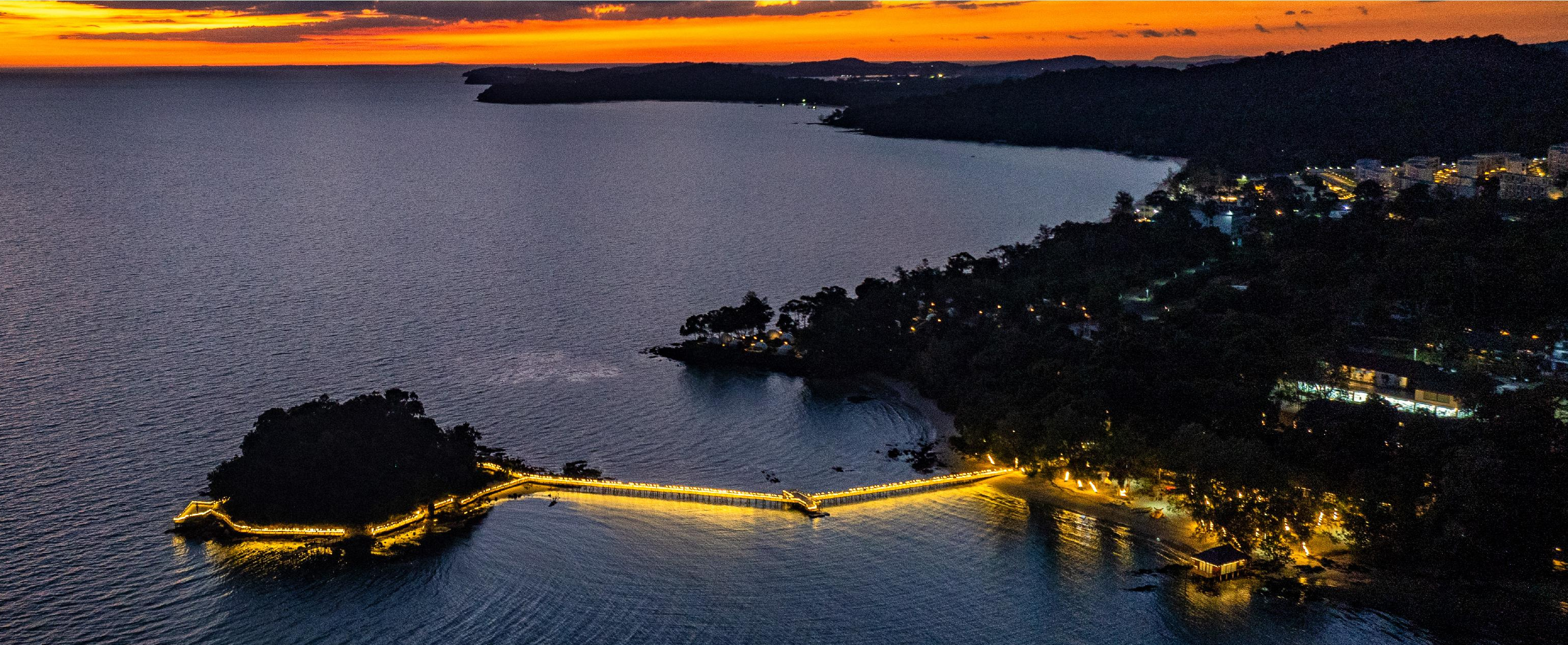 Sunset and illuminated bridge on the Golden Silver Gulf coast